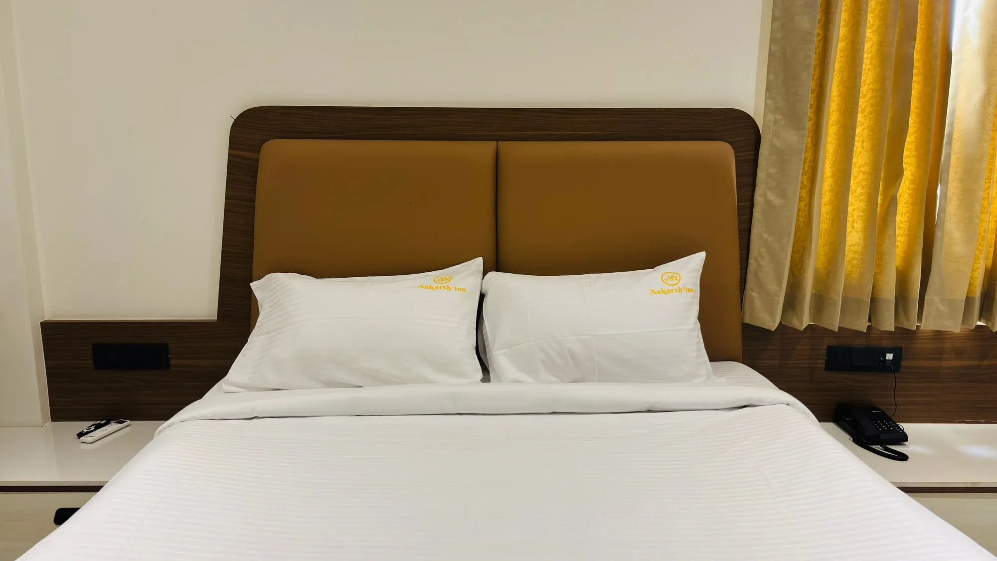 Queen bed with tan headboard