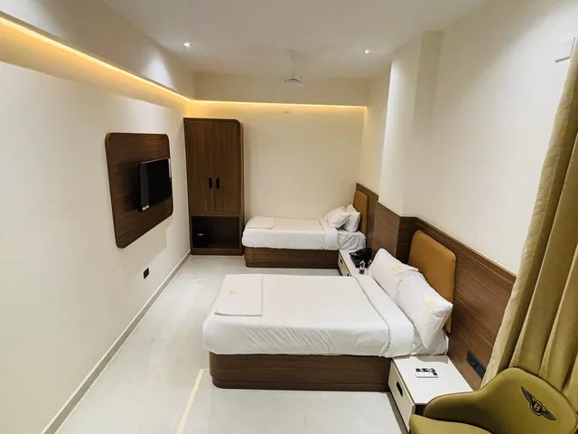 Twin Room seen from the entrance, with both beds made up in white